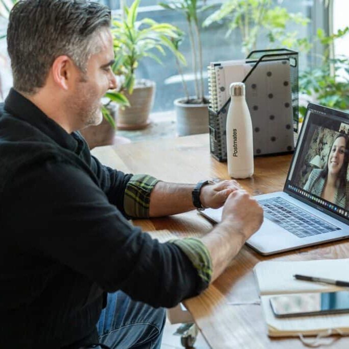 Man sitting at computer for virtual counseling appointment